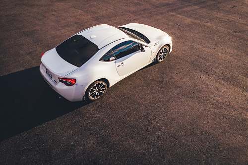 alloy wheel high-angle view of white coupe wheel